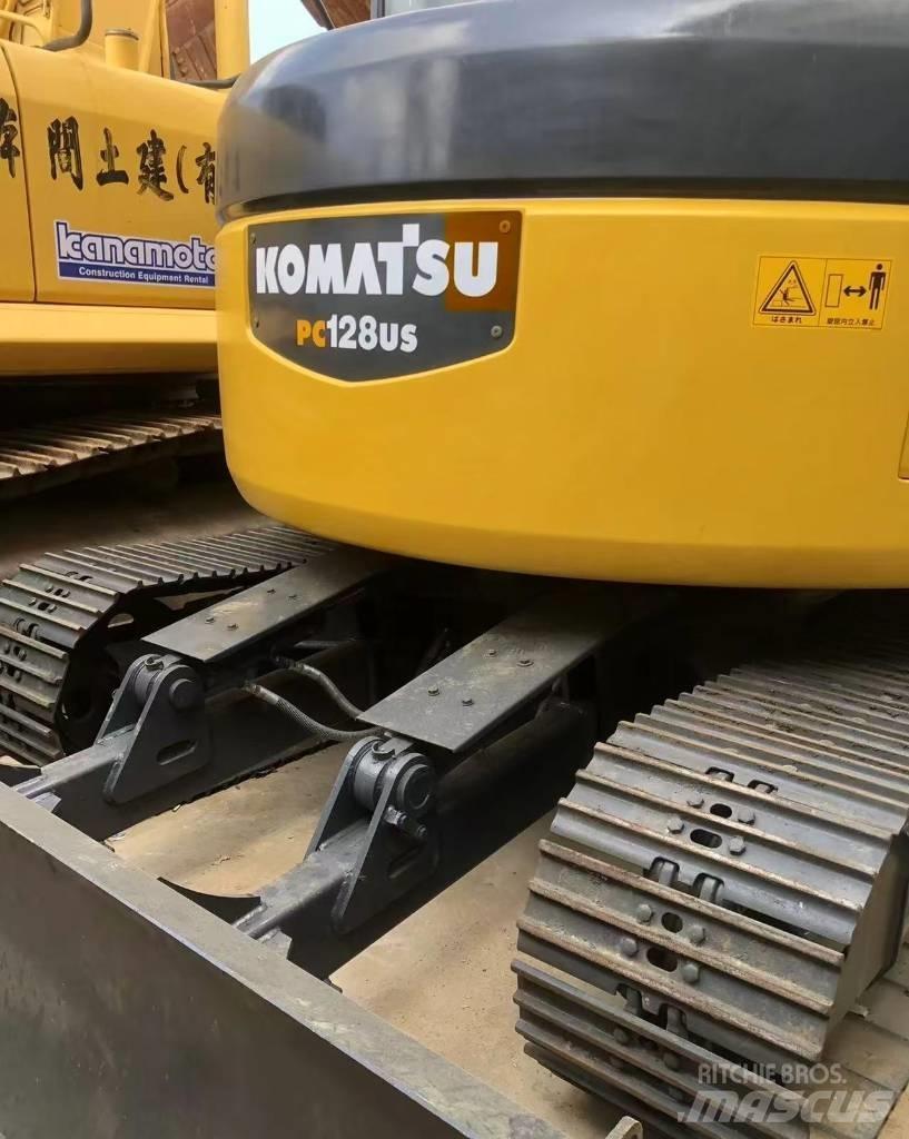 Komatsu 128 US Koparki gąsienicowe