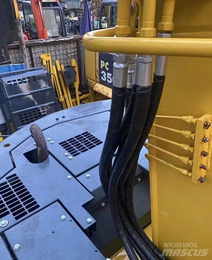 Komatsu 128 US Koparki gąsienicowe