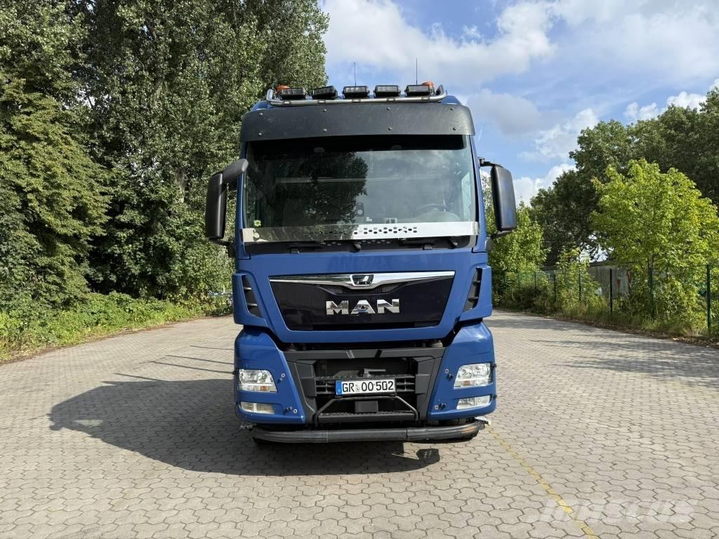 MAN TGX 33.500 Samochody do przewozu maszyn leśnych