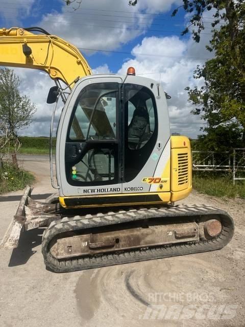 New Holland E 70 SR Midikoparki  7t - 12t