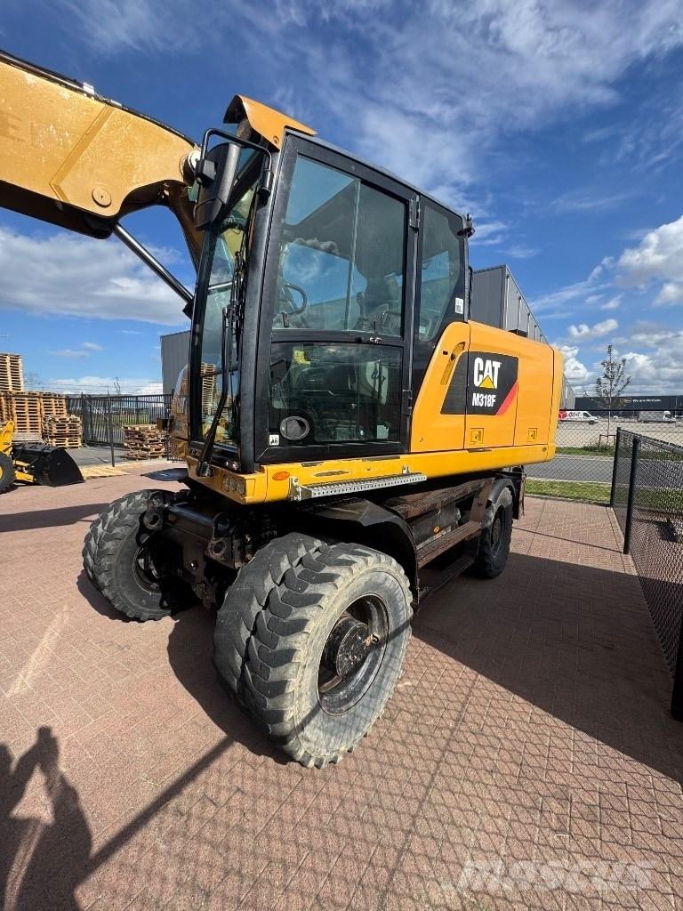 CAT 318 Koparki kołowe