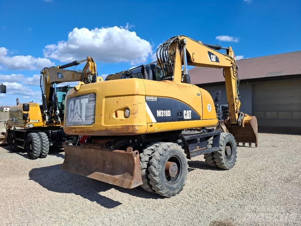 CAT 318 Koparki kołowe
