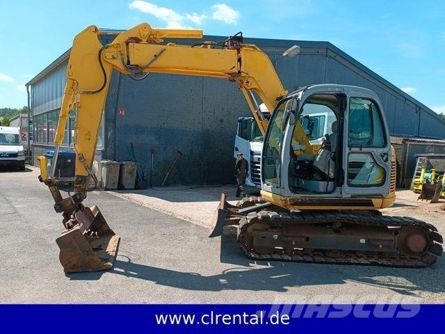 New Holland E70SR 4 Koparko-ładowarki