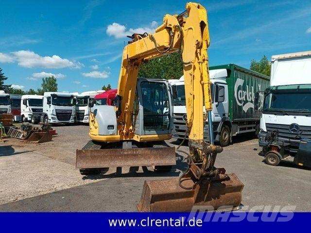 New Holland E70SR 4 Koparko-ładowarki