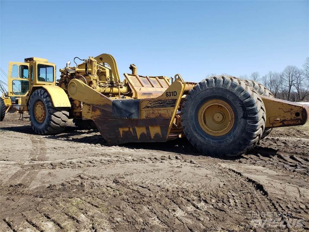 CAT 631D Skrobaki