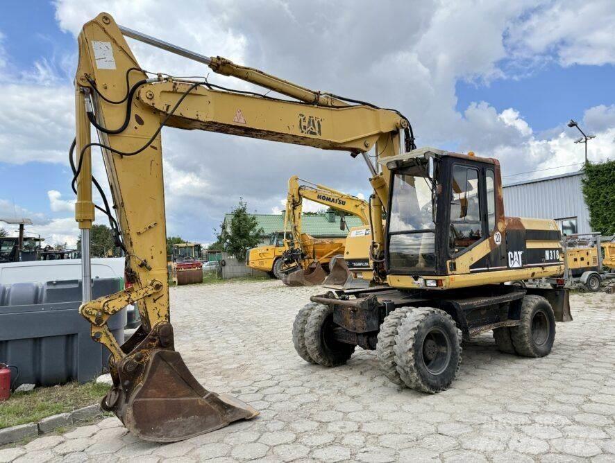 CAT M318 Koparki kołowe